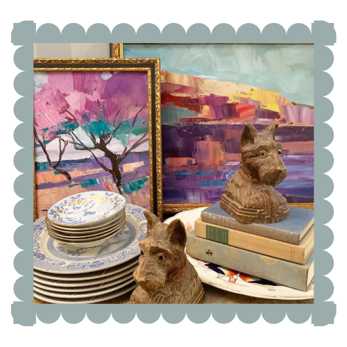 Antique plates, paintings, wooden dogs and books