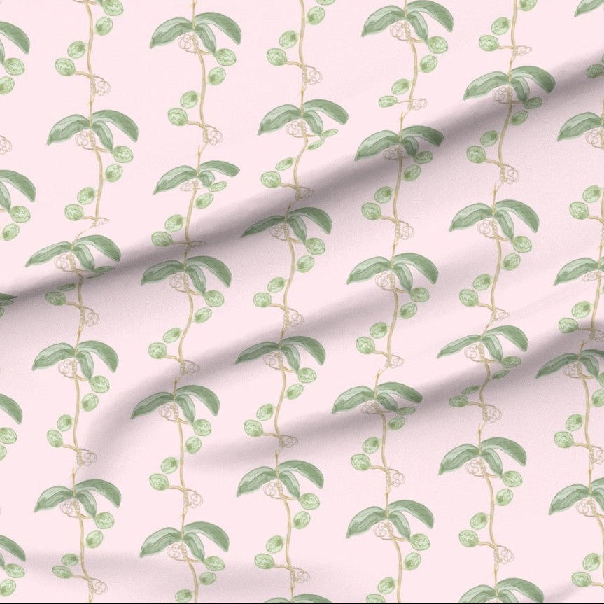 Fabric with green leaf and flower seed pot vine pattern on a pink background