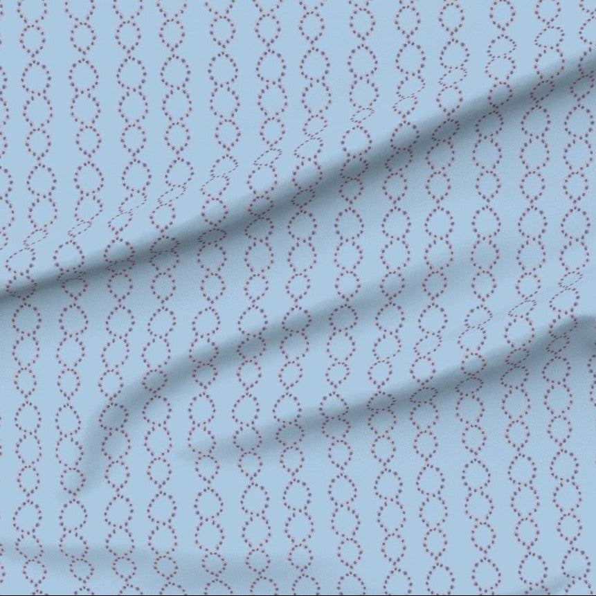 Fabric with a subtle water drop chain golgi apparatus pattern on a light blue background