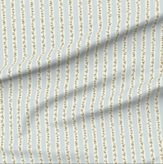 Fabric with floral vine vertical stripes on a blue background